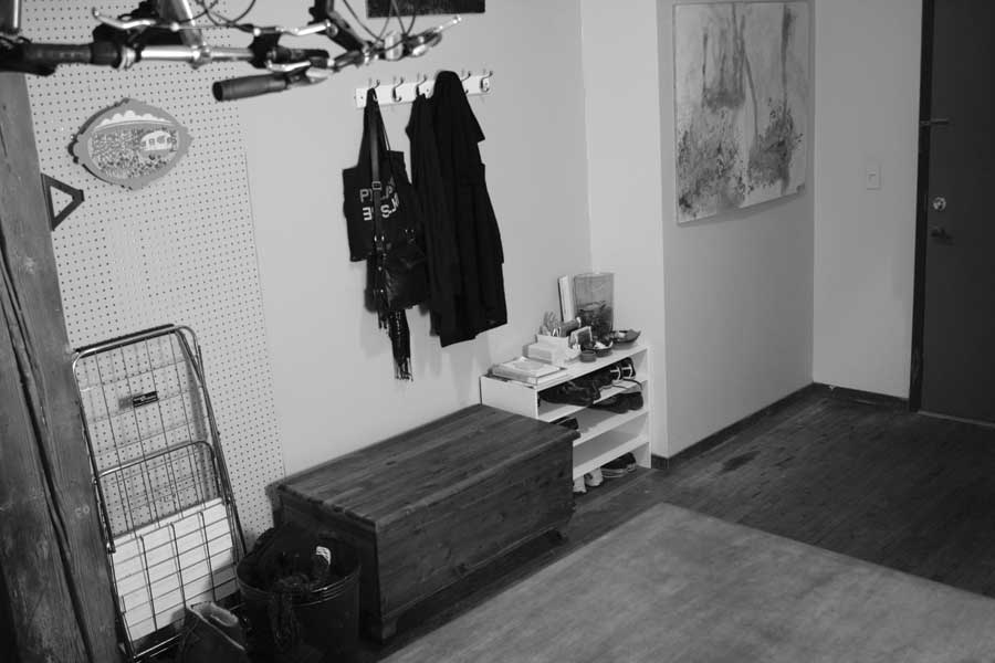 In Lin’s proposed solution, shoe cubbies and “grab-and-go” hooks make coming and going easy and quick. Shelves behind a decorative curtain offer attractive, organized storage.